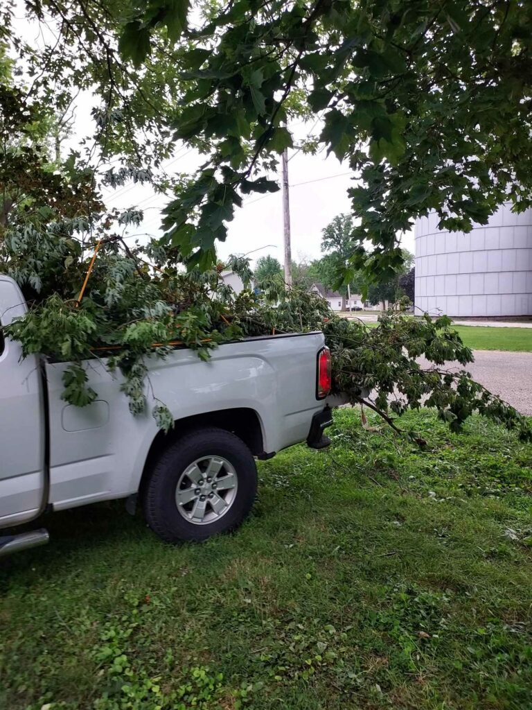 In this photo, the Twig Truck is loaded with branches during a storm cleanup project.